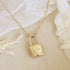 gold chain necklace with lock engraved with text "In Christ". Necklace is a part of the Love Story collection by Maive