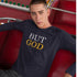 White man wearing black Christian unisex long-sleeve shirt that says "BUT GOD" in caps lock. 