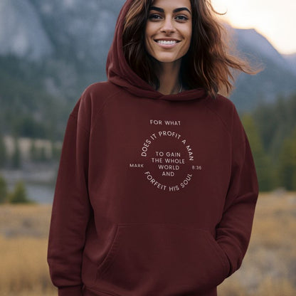 Indian woman wearing a maroon Christian hoodie that says &quot;For what does it profit a man to gain the whole world and forfeit his soul&quot; and the verse Mark 836 right in the middle