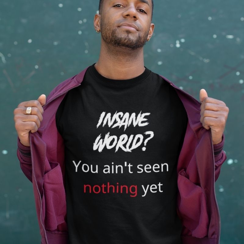 Black man wearing black t-shirt shirt that says &quot;Insane world? You aint seen nothing yet&quot; the shirt is from Amela&