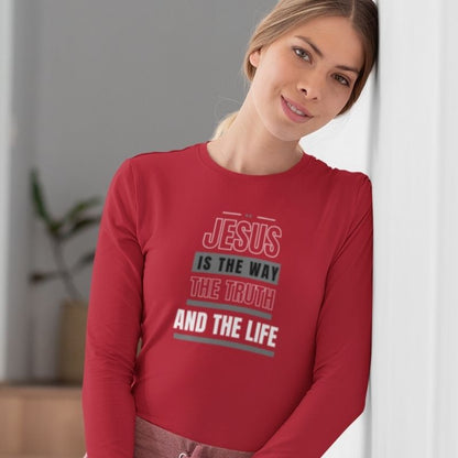 White woman wearing a red Christian long-sleeve shirt. The shirt text reads &quot;Jesus is the way, the truth, and the life&quot;