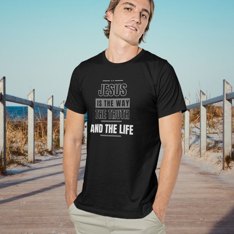 White man wearing a black Christian unisex t-shirt that says in big bold lettering:
&quot;JESUS IS THE WAY, THE TRUTH, AND THE LIFE&quot;