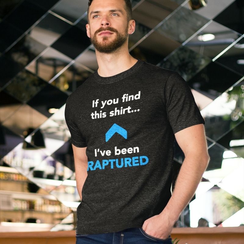 White man wearing black Christian unisex t-shirt. There is a big blue arrow pointing upward in the middle of the shirt. Above the arrow, it says &quot;If you find this shirt...&quot; and below, it says &quot;I&