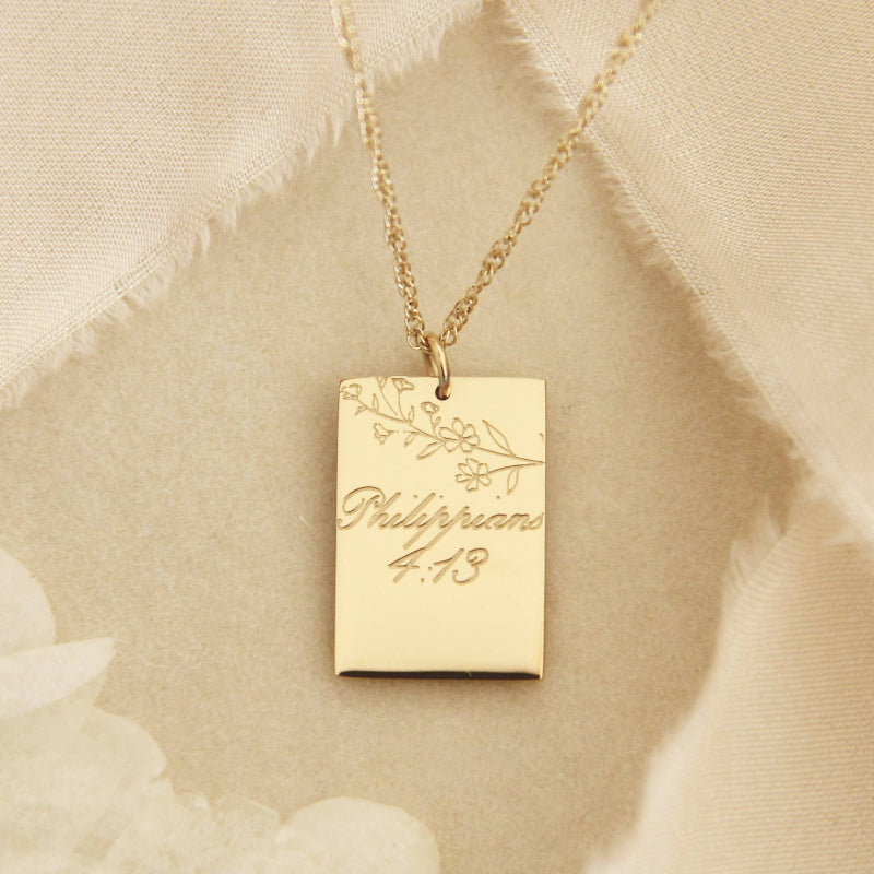 Gold chain necklace with a gold square pendant engraved with &quot;Philippians 4:13&quot; and some leaves