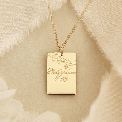 Gold chain necklace with a gold square pendant engraved with &quot;Philippians 4:13&quot; and some leaves