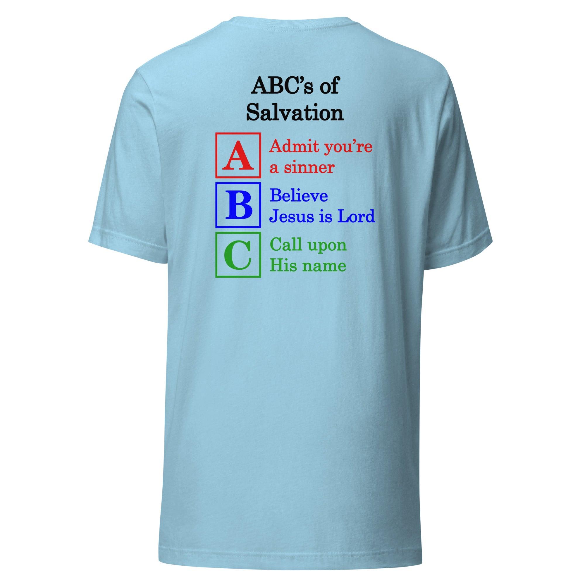 Flatlay of a light blue t-shirt, showcasing a Christian design, that says:
ABC&