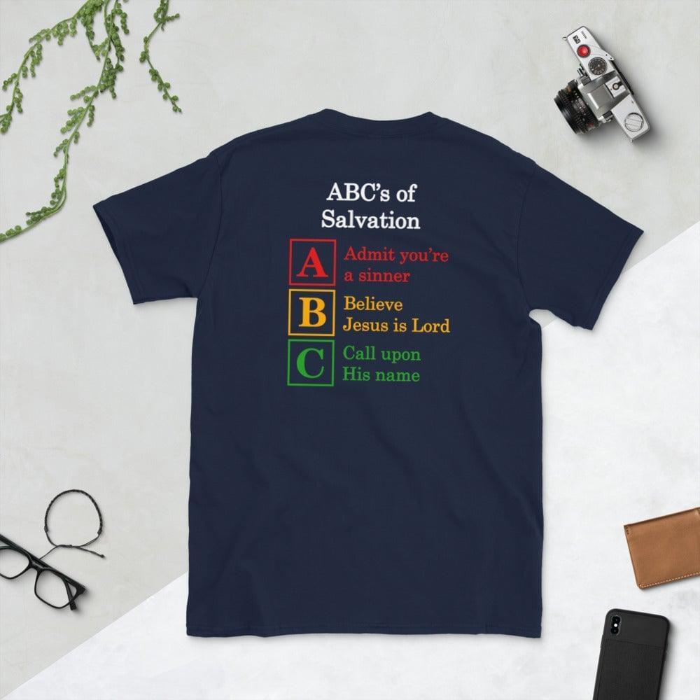 A flatlay photo of a back of a navy shirt, showcasing a a Christian design, that says:
ABC&