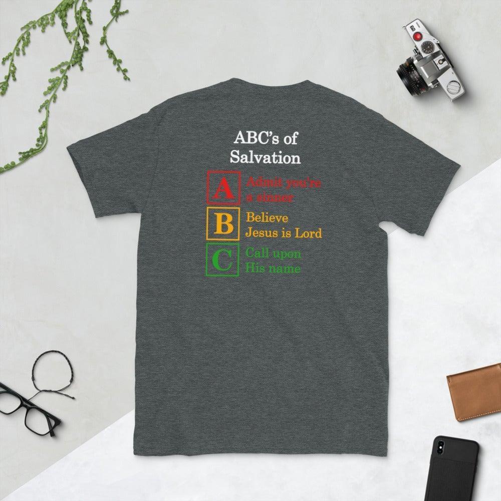 A flatlay photo of the back of a gray shirt, showcasing a a Christian design, that says:
ABC&