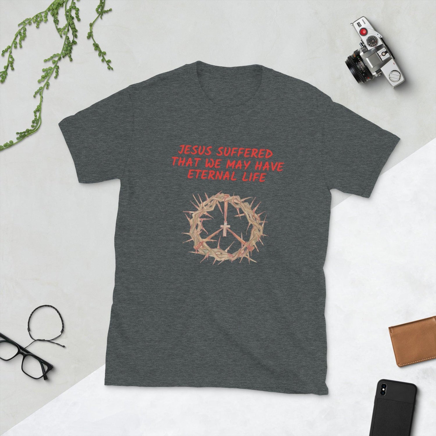 Flatlay of a gray Christian t-shirt that says &quot;Jesus suffered that we may have eternal life&quot;.

Below the text, there. is a graphic of a crown of thorns, with a cross in the middle. The crown of thorns was what Jesus wore on his head during the Crucifixion.