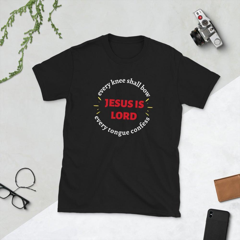 Black Christian unisex t-shirt that says in a circle &quot;Every knee shall bow, every tongue confess&quot; with &quot;Jesus is Lord&quot; in the middle. The shirt is sold from Amela&