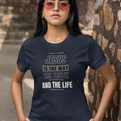 Hispanic woman wearing a navy Christian unisex t-shirt that says in big bold lettering:
&quot;JESUS IS THE WAY, THE TRUTH, AND THE LIFE&quot;