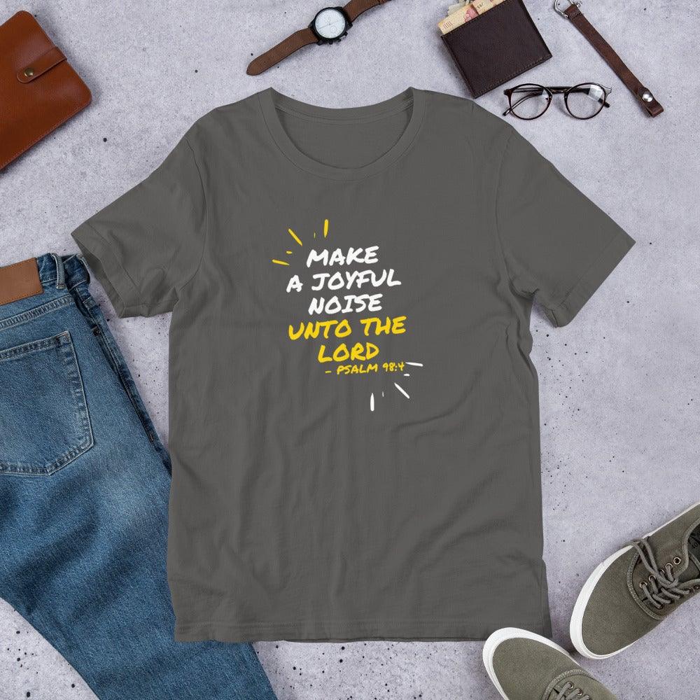 Flatlay of a gray Christian t-shirt that says &quot;Make joyful noise unto the Lord&quot; with &quot;Pslam 98:4 underneath&quot;. Surrounding the text, there are lines that show movement or music.