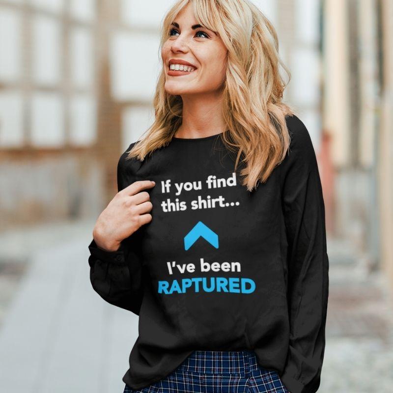 White woman wearing black Christian long-sleeve shirt. There is a big blue arrow pointing upward in the middle of the shirt. Above the arrow, it says &quot;If you find this shirt...&quot; and below, it says &quot;I&